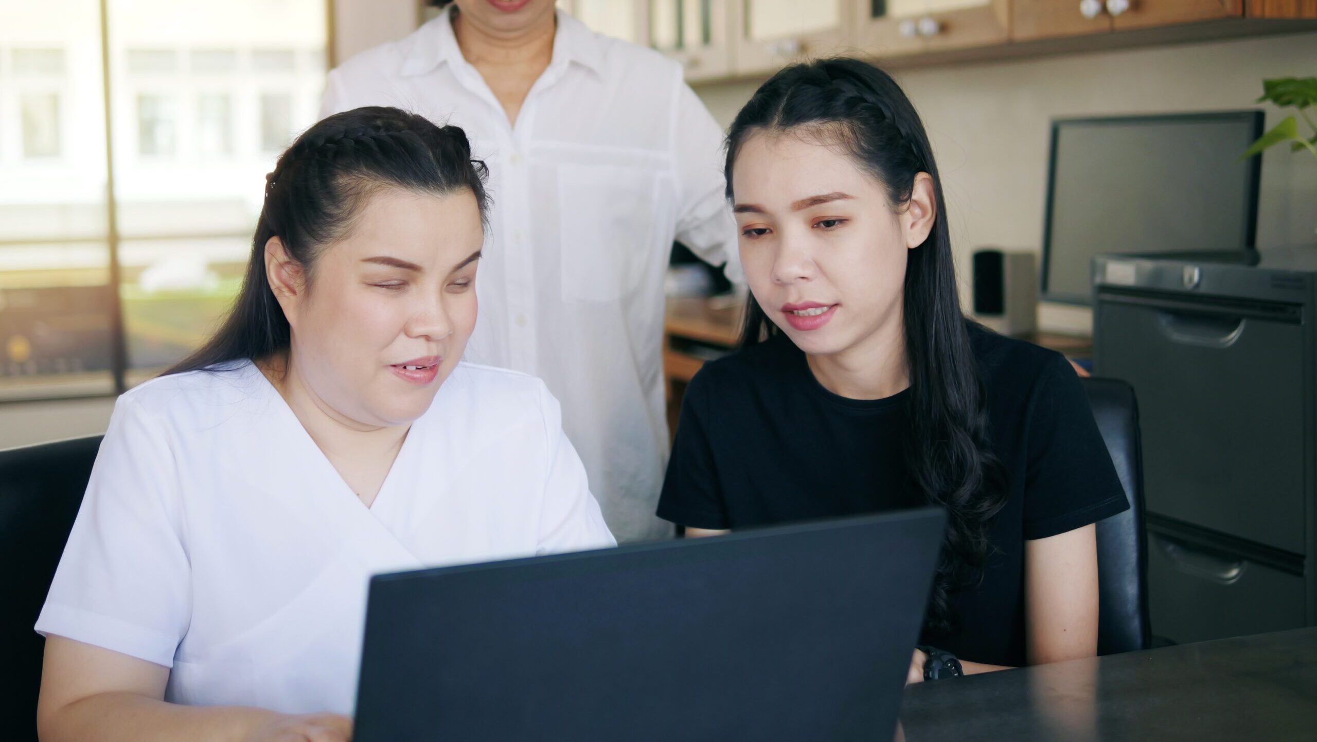Asian,Women,Co-workers,In,Workplace,Including,Person,With,Blindness,Disability